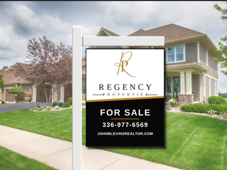Regency Properties FOR SALE yard sign with John Blevins phone 336-977-6569 and website johnblevinsrealtor.com